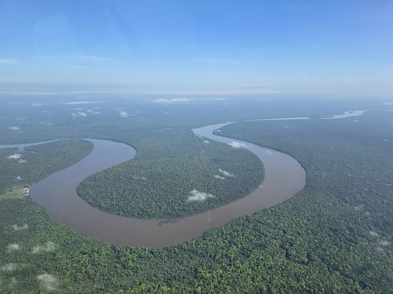 missing Surinamese men - Aerial view of the Corentyne River winding through rainforest