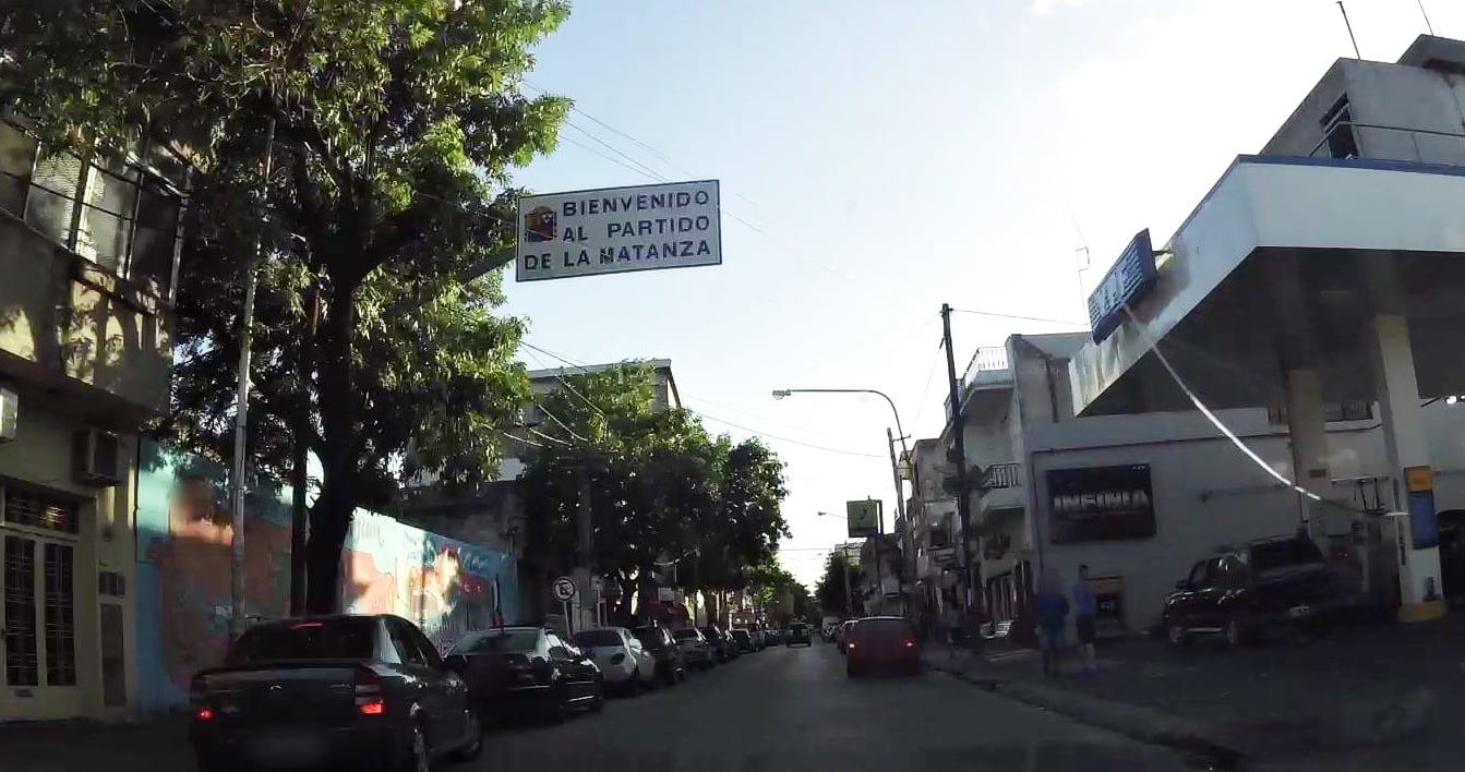 A street in La Matanza, part of greater Buenos Aires, with a service station