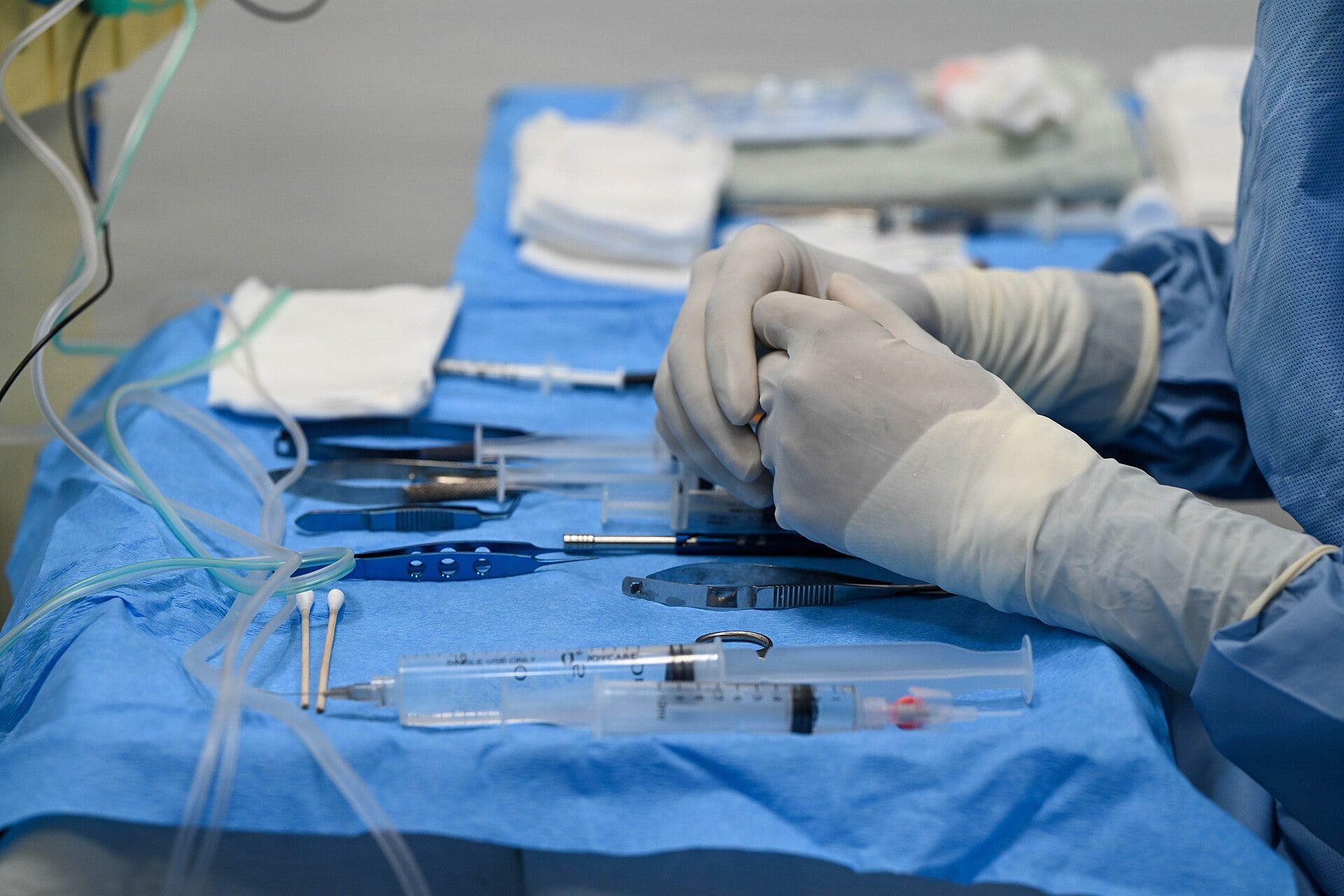 A Guyanese surgical technician prepares vitrectomy instruments at Georgetown Public Hospital during the LAMAT 2026 medical mission