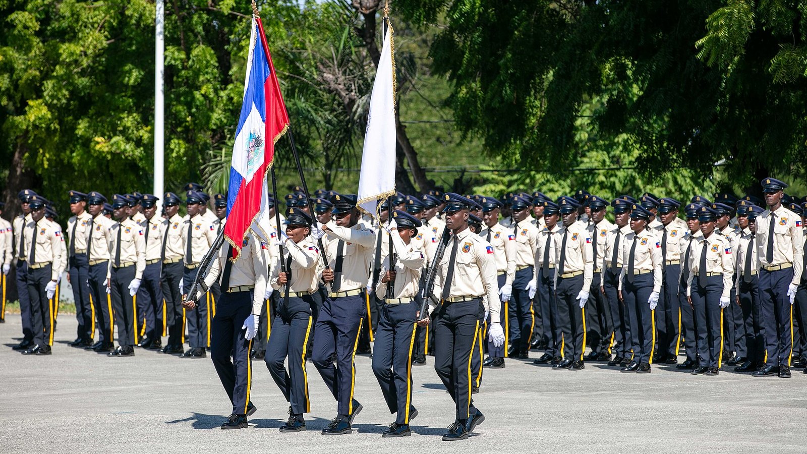 Haitian National Police cadets parade with the national flag in Port-au-Prince