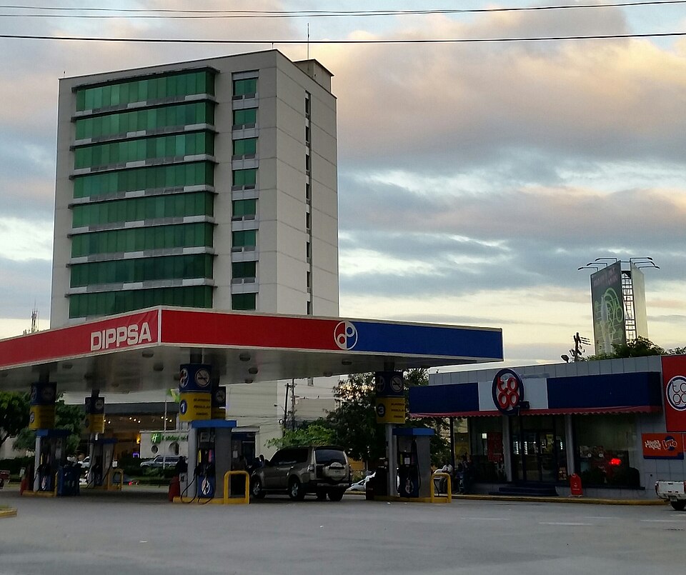 A petrol station forecourt with pumps under a red and blue canopy in San Pedro Sula, where Honduras fuel prices rise again from 28 September