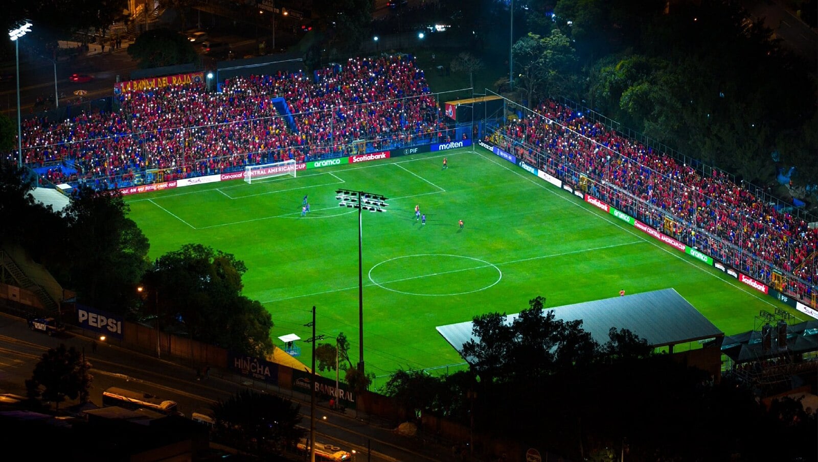 Estadio El Trébol at night in Guatemala City, venue of Guatemala vs El Salvador
