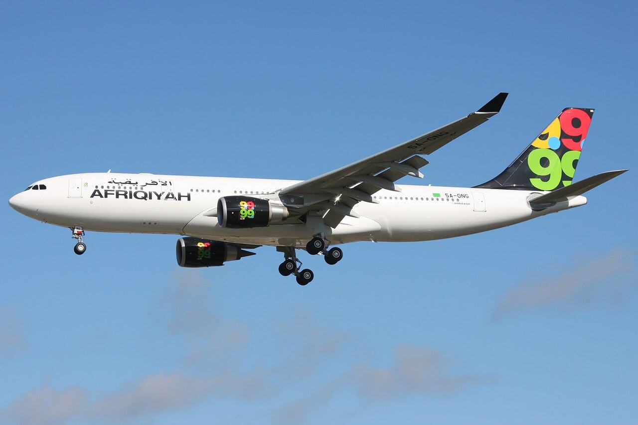 A Libyan-registered Airbus A330 in flight, illustrating Libya France direct flights
