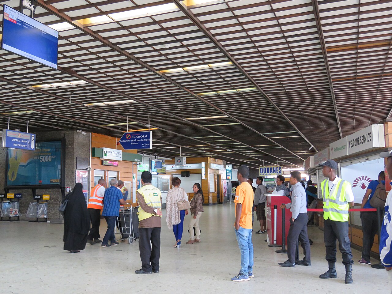 Passengers and staff in the terminal at Antananarivo airport, where rules on Madagascar private jets now apply