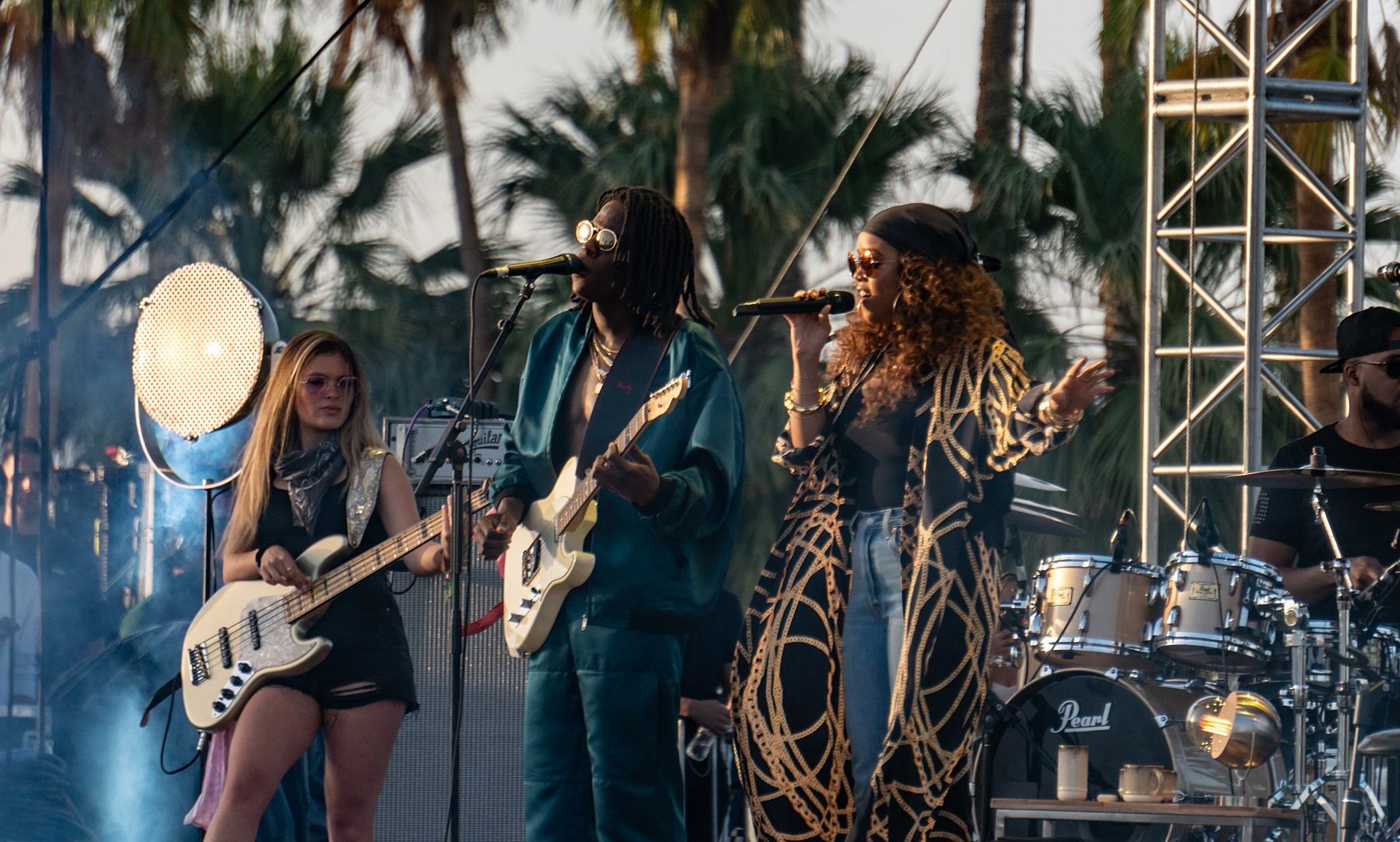 Musicians performing on an outdoor festival stage