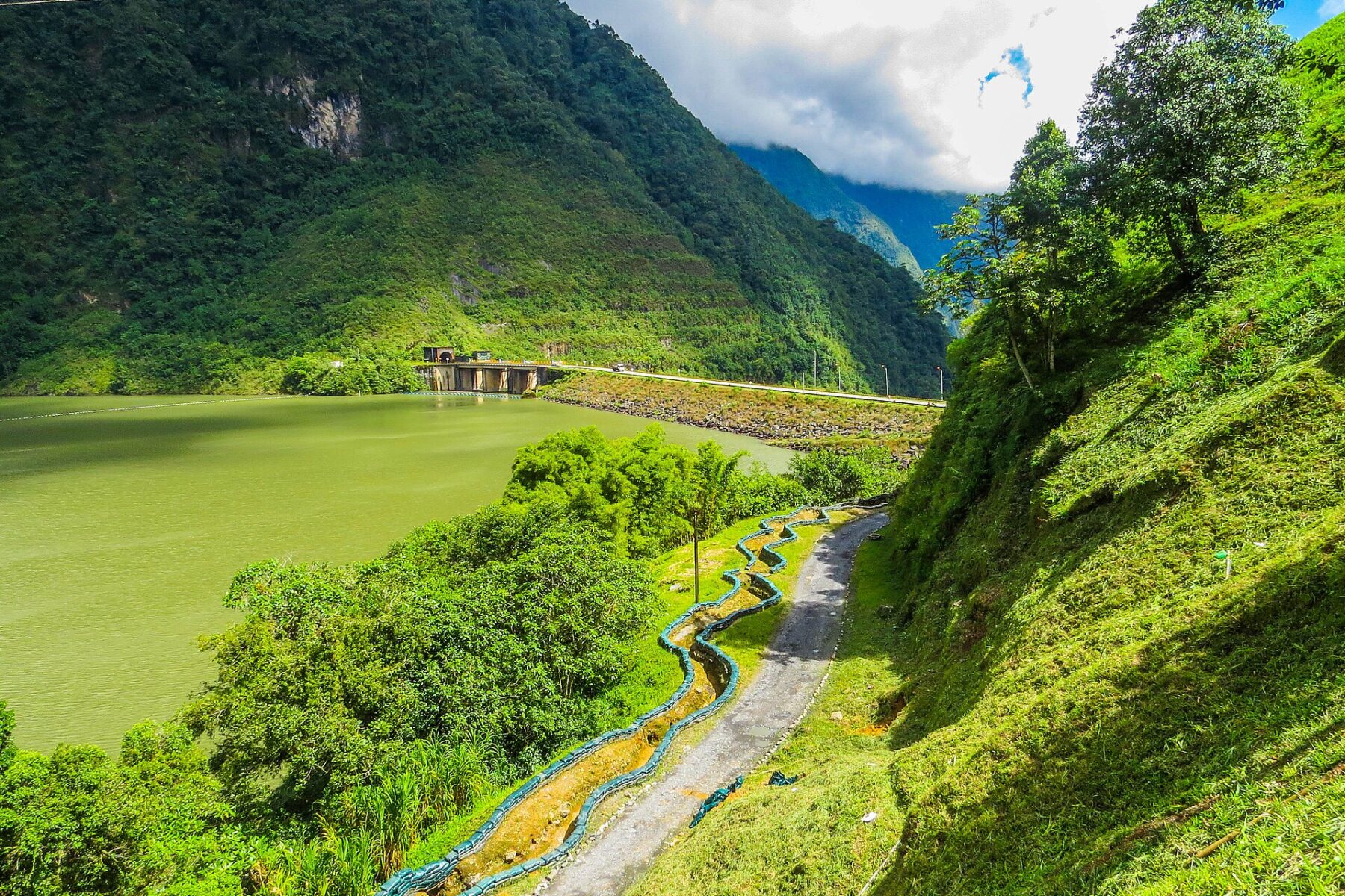 The Chivor hydroelectric dam and reservoir in the Colombian mountains under cloud