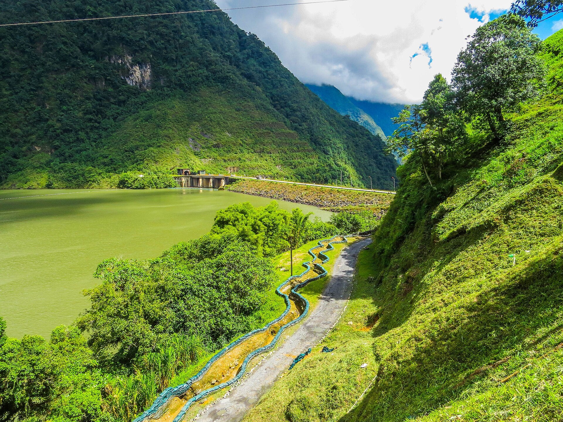 The Chivor hydroelectric dam and reservoir in the Colombian mountains under cloud