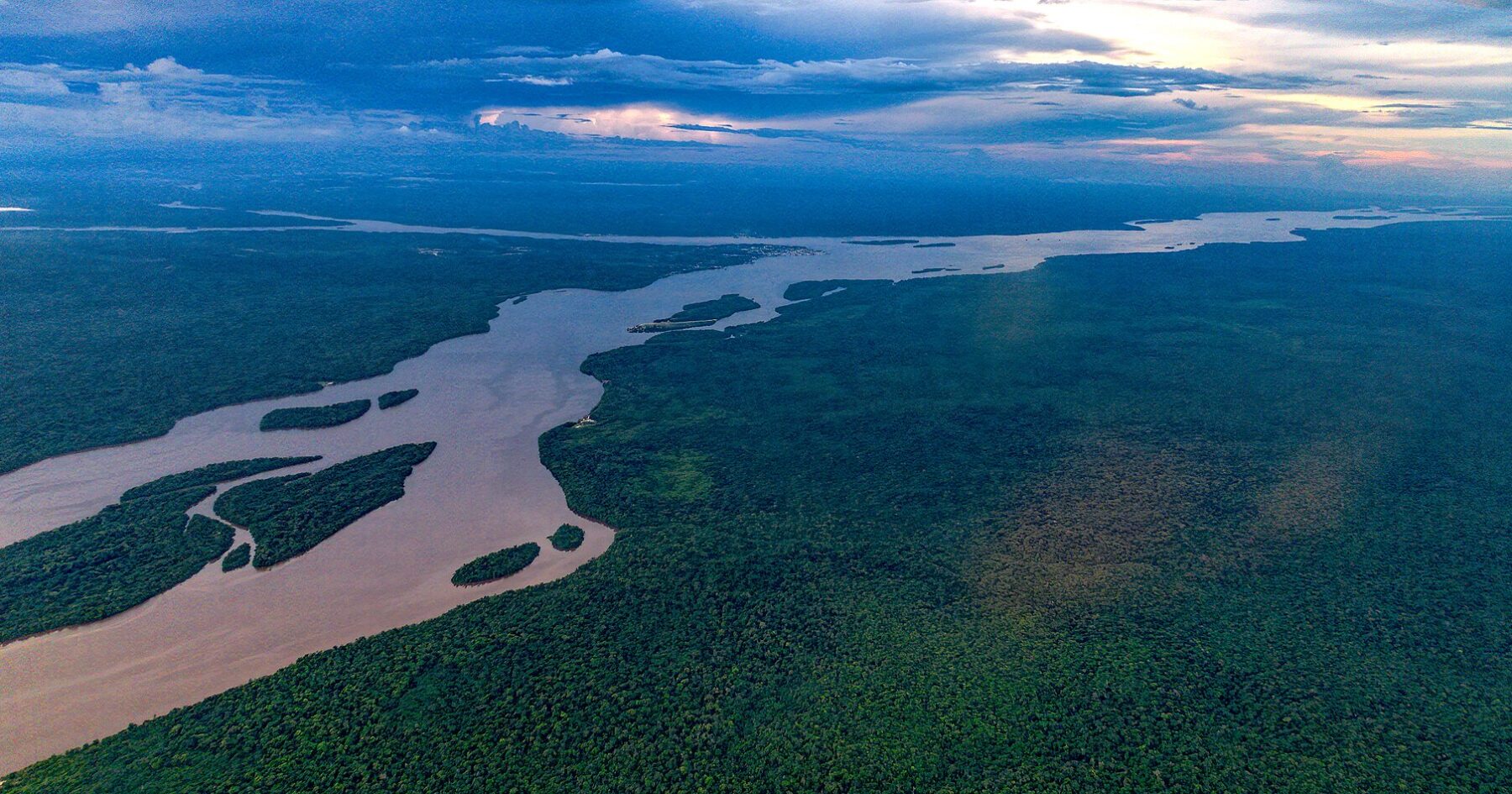 An aerial view of the Essequibo river and surrounding forest in Guyana