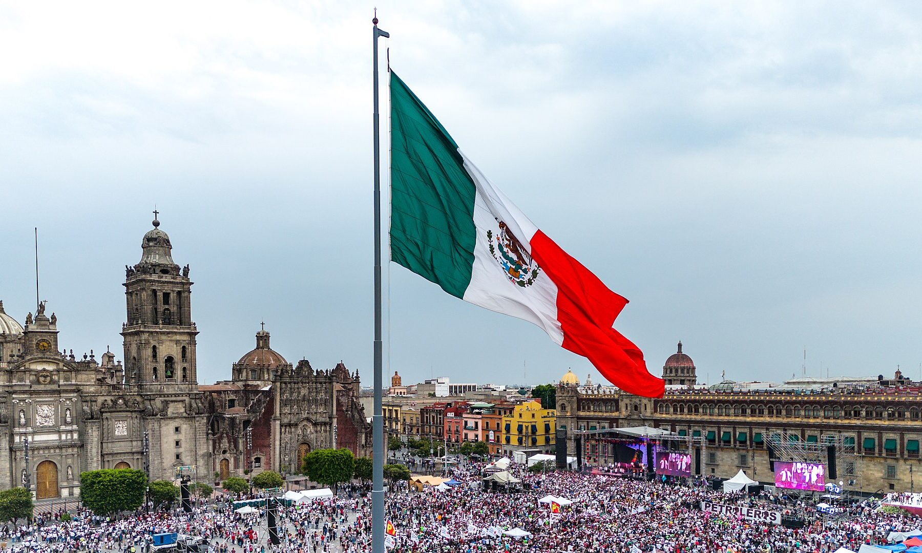 The giant Mexican national flag flying above the Zocalo square in Mexico City