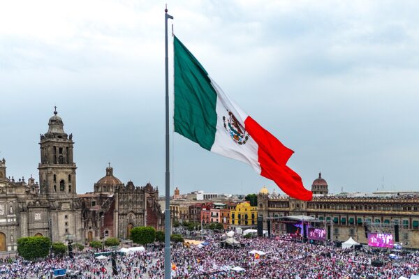 The giant Mexican national flag flying above the Zocalo square in Mexico City