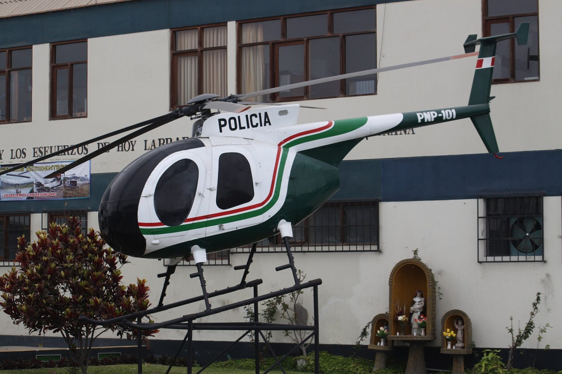 A Peruvian National Police helicopter displayed outside a police building