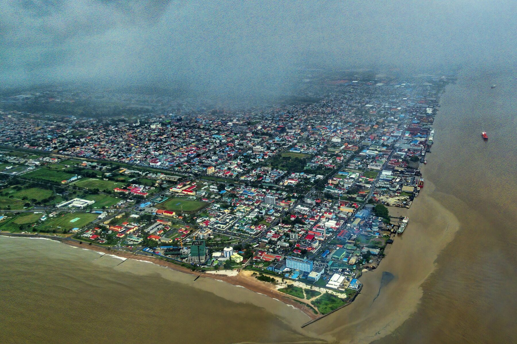 is Guyana safe for expats Georgetown aerial view Demerara River