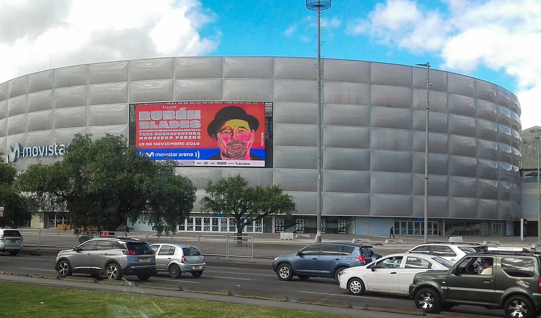 The rounded silver facade of the Movistar Arena in Bogotá, Colombia, the venue for the Kris R Movistar Arena Bogotá concert on 23 October 2026