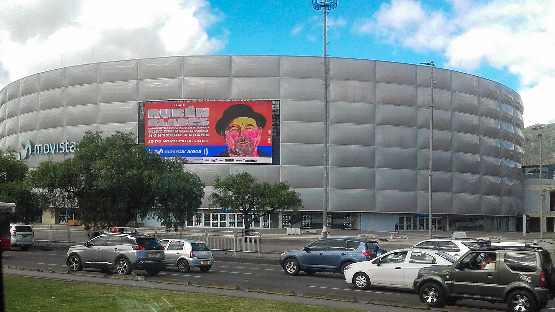 The rounded silver facade of the Movistar Arena in Bogotá, Colombia, the venue for the Kris R Movistar Arena Bogotá concert on 23 October 2026