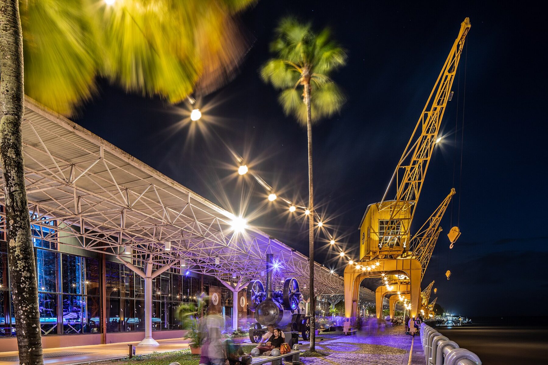 Estação das Docas waterfront in Belém, Pará, Brazil, at night with its yellow cranes lit up