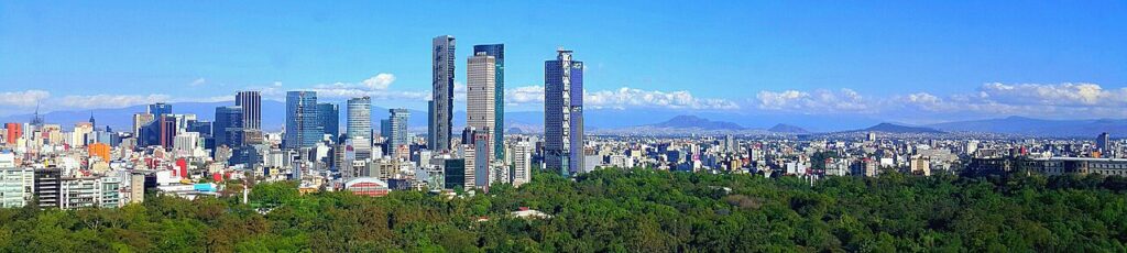 Mexico City skyline with buildings and green trees