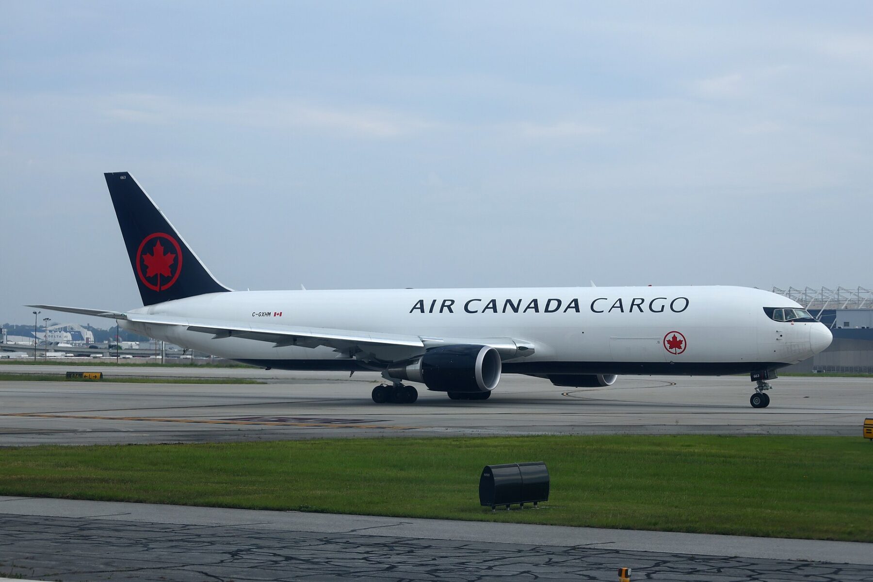 A Boeing 767 freighter aircraft on an airport apron