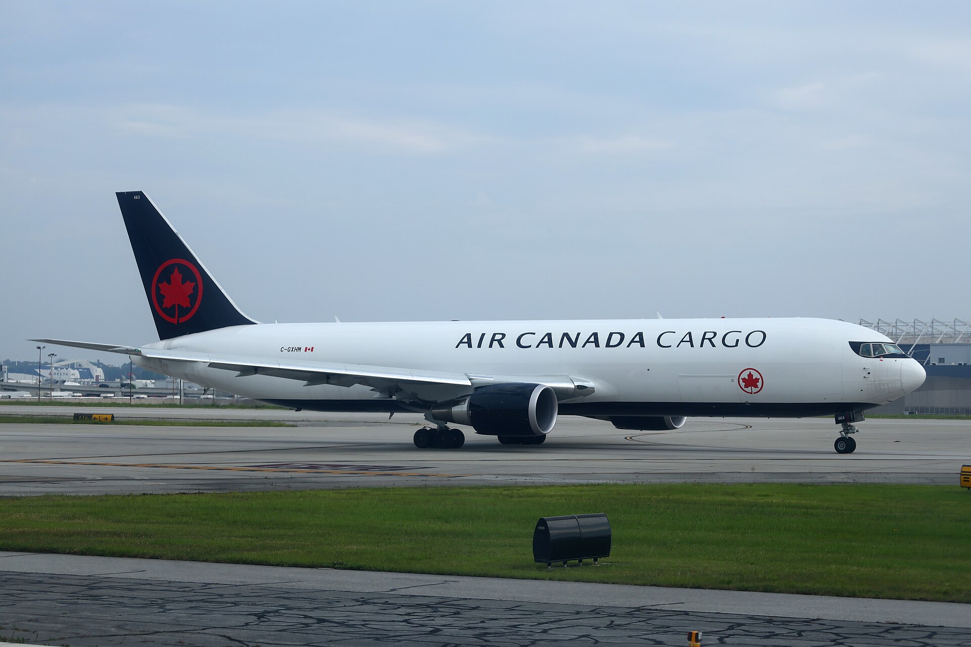 A Boeing 767 freighter aircraft on an airport apron