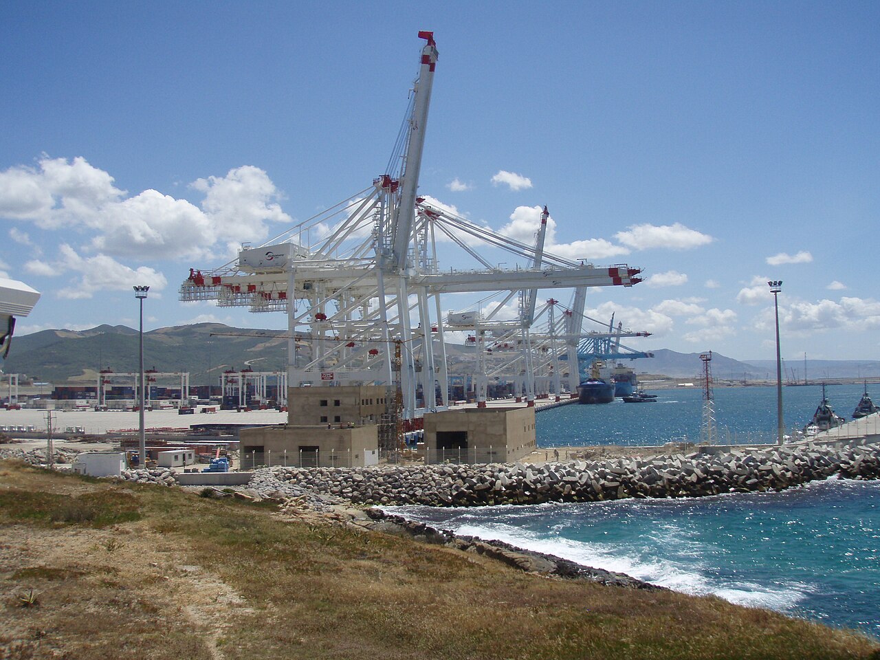 Morocco explained 2026 — container cranes at the Tanger Med port on the Strait of Gibraltar