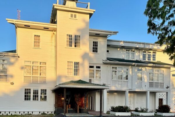 moving to Guyana: Castellani House, a white timber colonial building in Georgetown