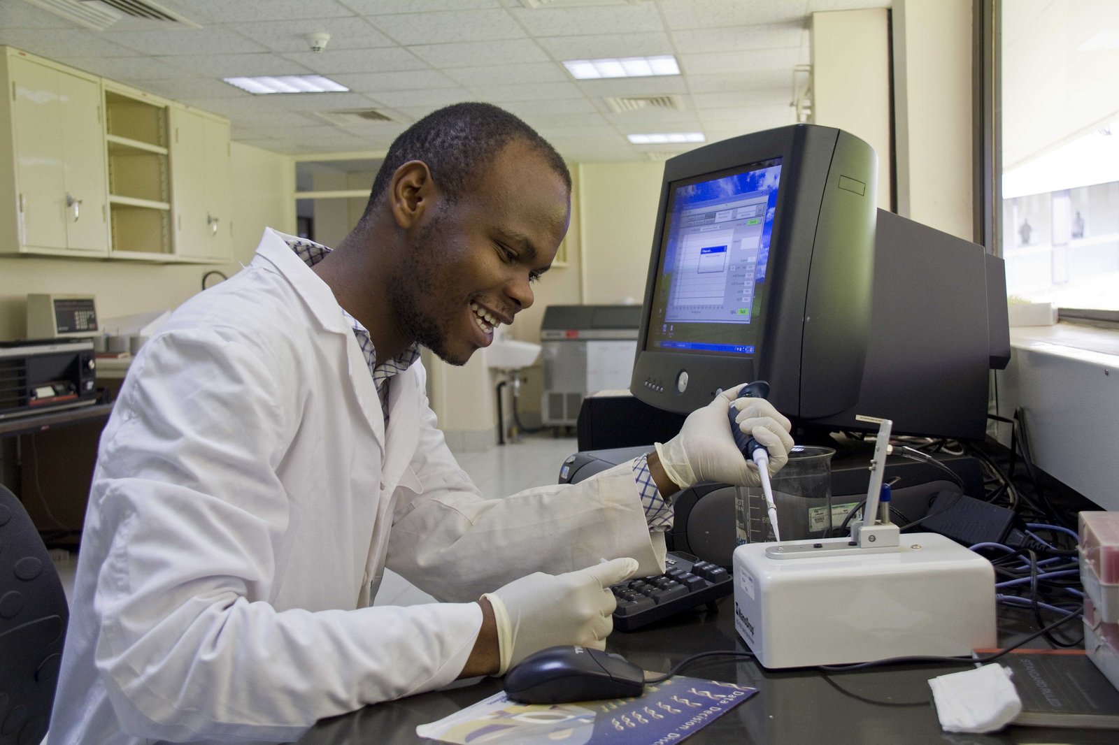 A postgraduate researcher works in a laboratory at Kenyatta University, Kenya