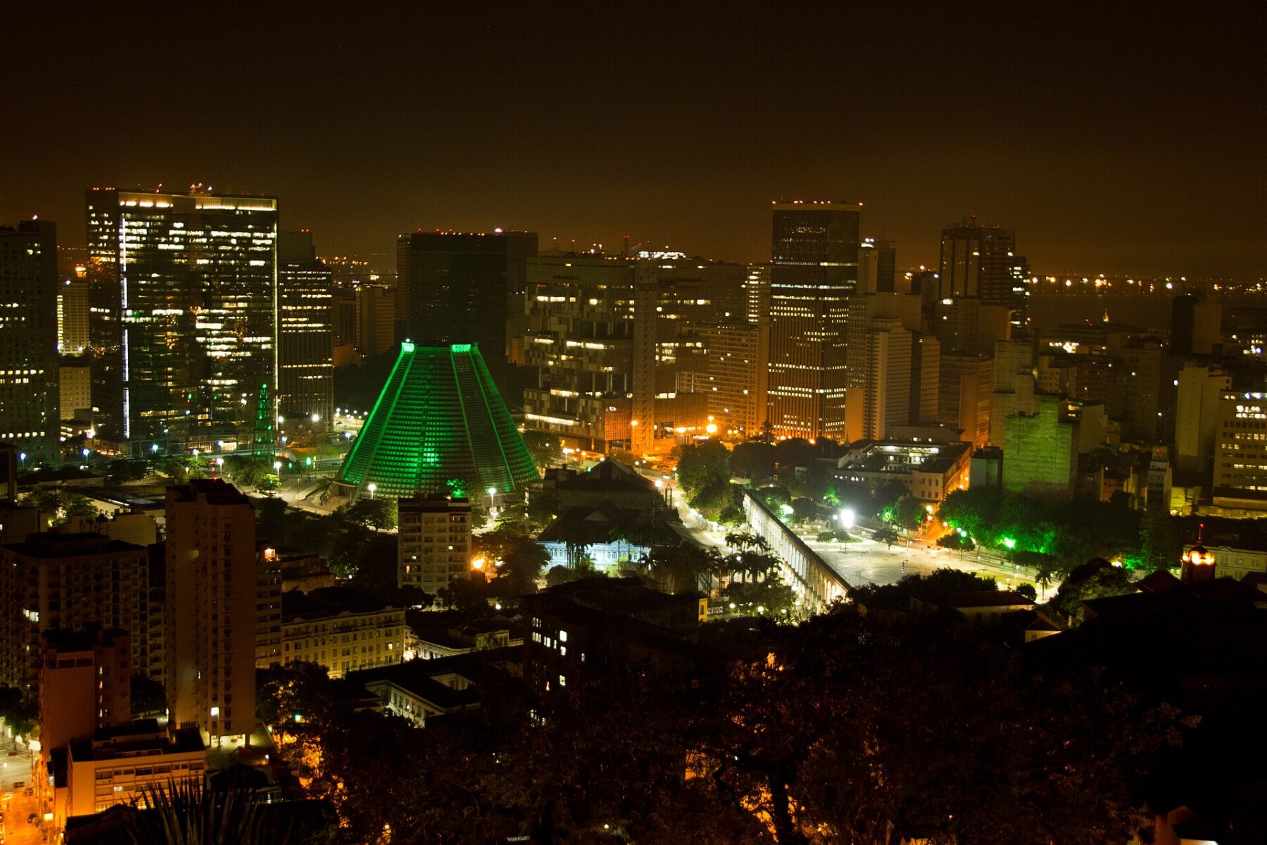 Central Rio de Janeiro at night, with the Lapa Arches and the lit Metropolitan Cathedral