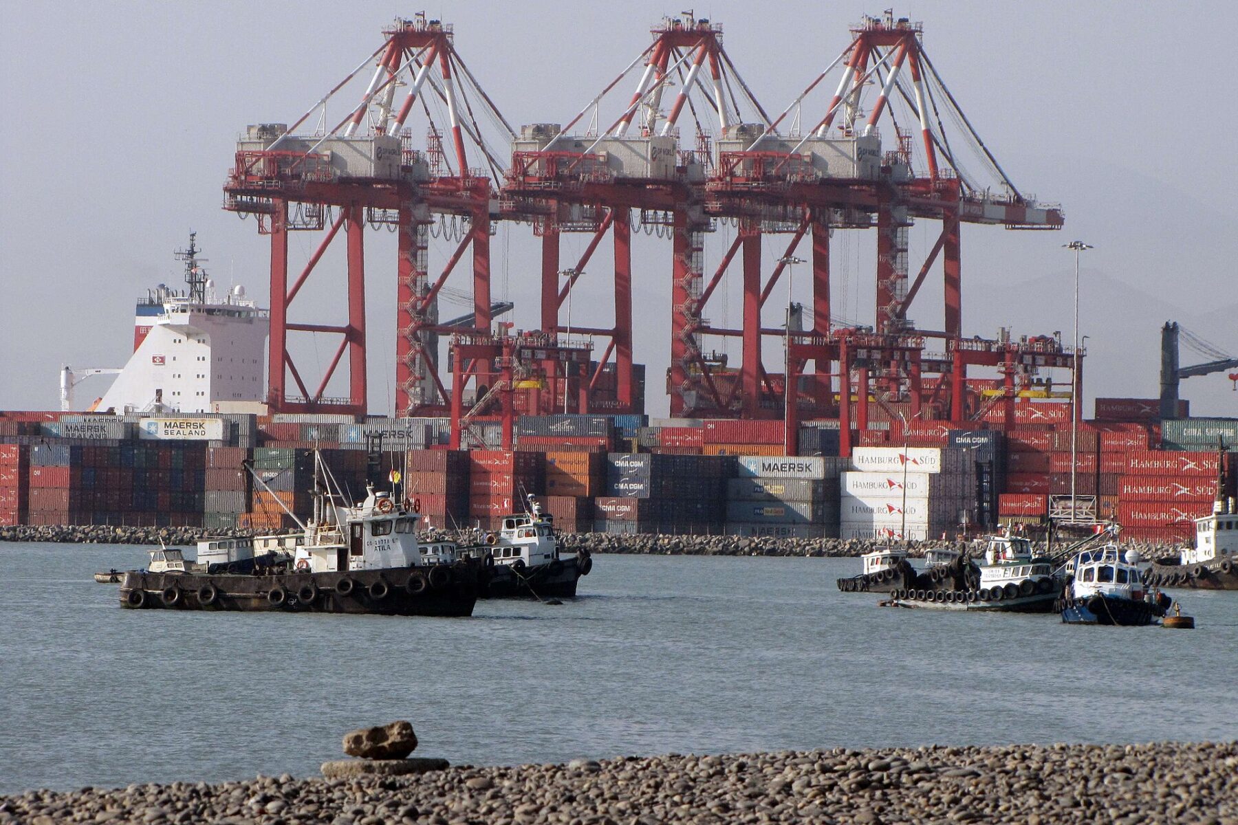 Container port with cranes, ships, and cargo containers