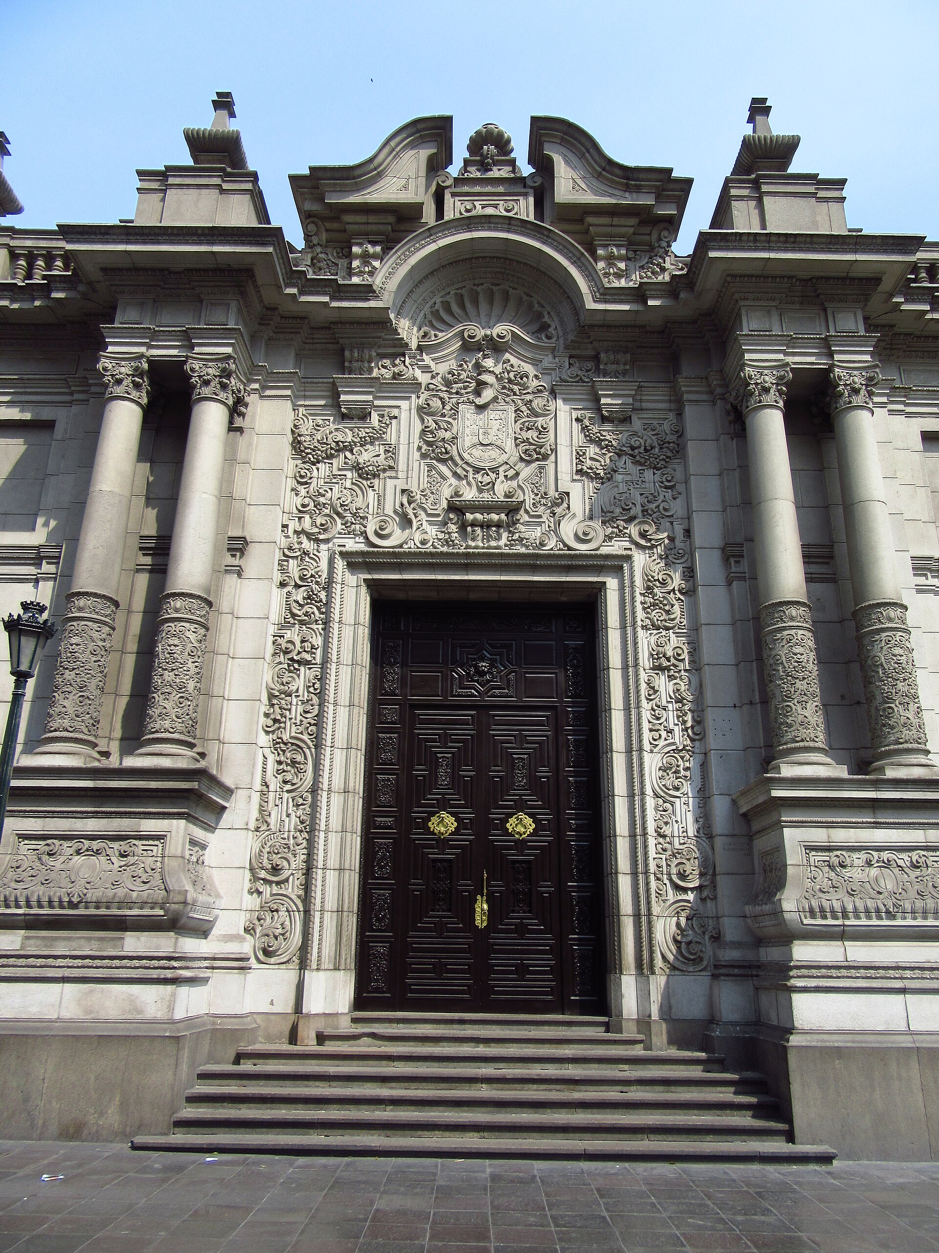 The carved baroque main door of the Government Palace in Lima, Peru