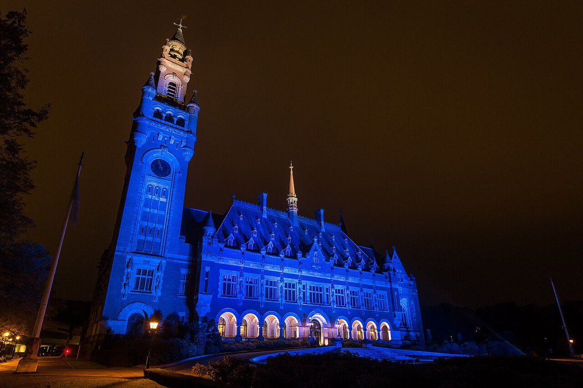 The Peace Palace in The Hague, seat of the International Court of Justice, lit in blue