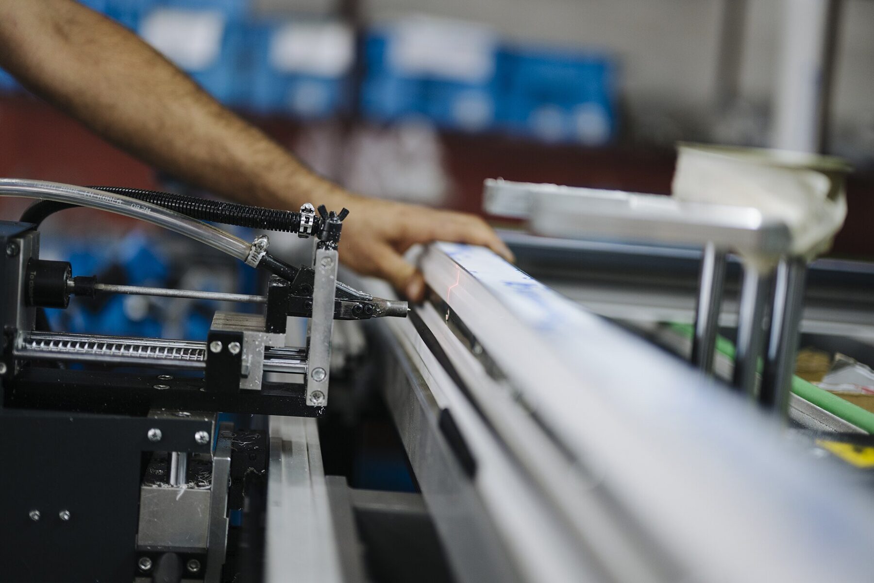 machinery and equipment - a worker on a factory assembly line