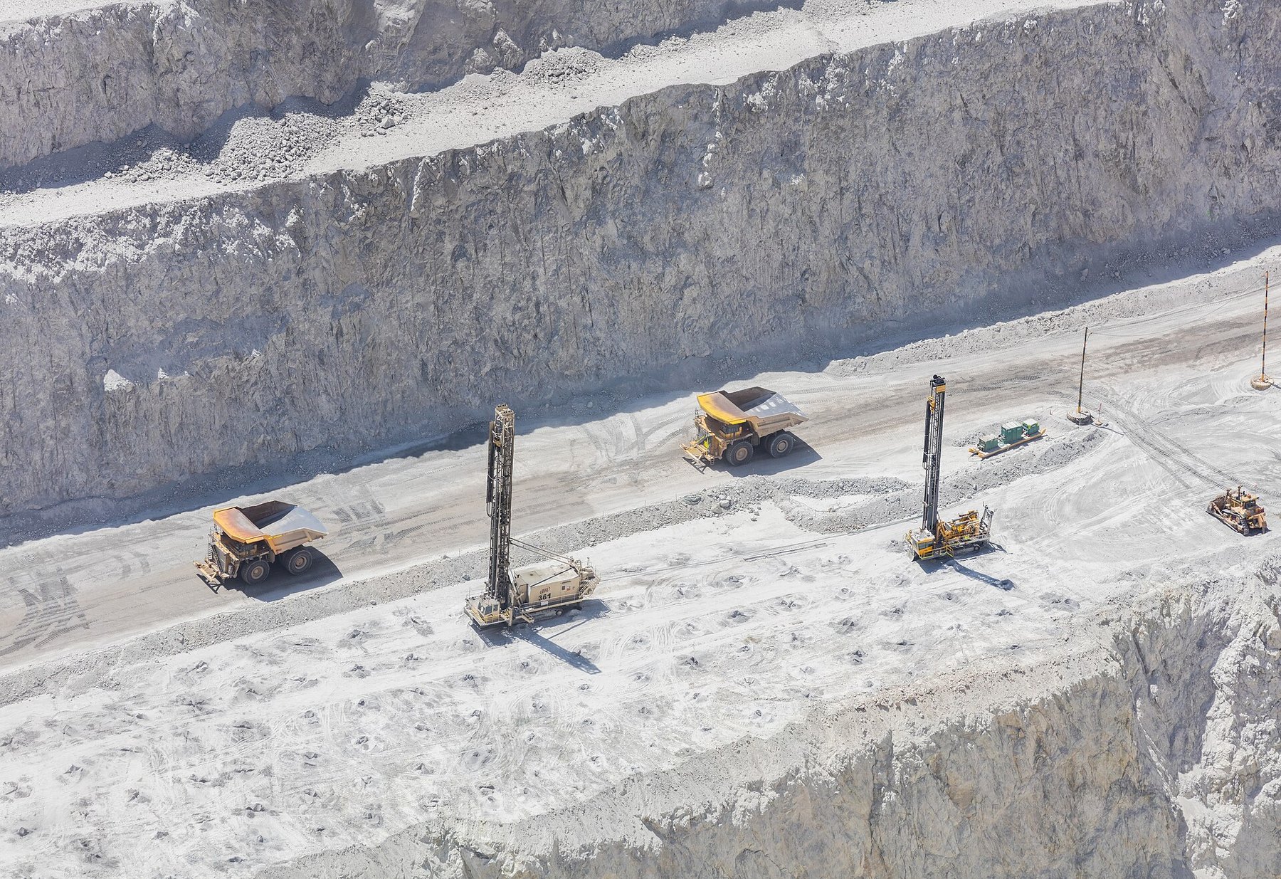 Haul trucks working a bench at the Chuquicamata pit, Chile