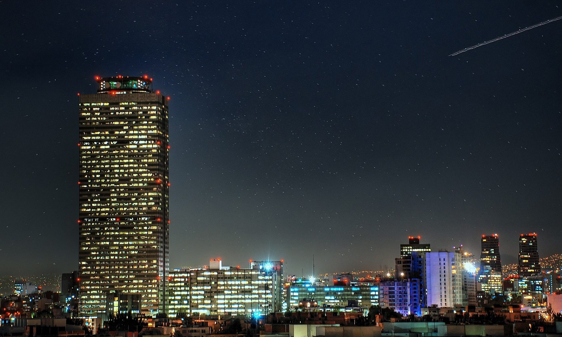 Mexico City skyline at night with stars