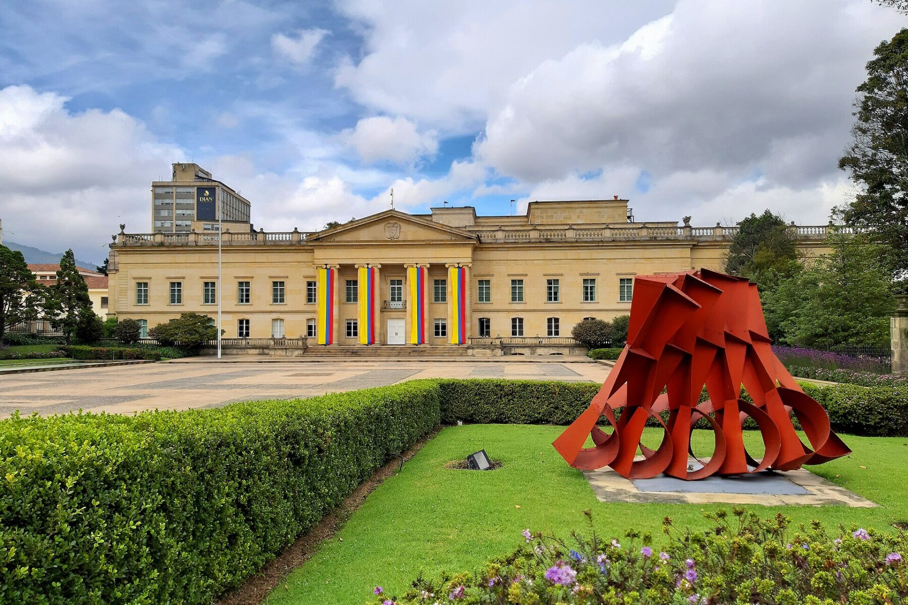 The Casa de Nariño presidential palace in Bogotá, Colombia, with a red sculpture in front