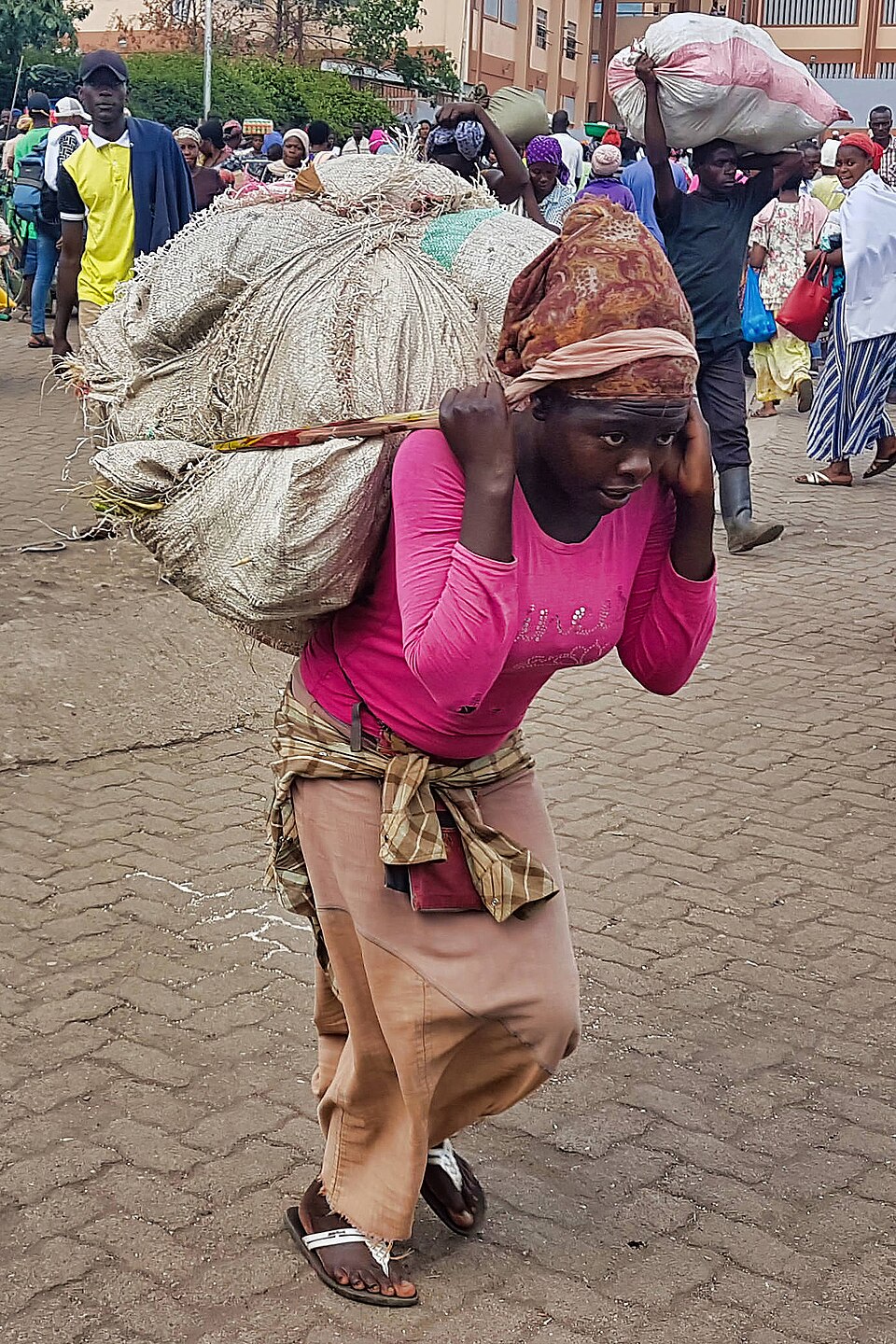 A trader carrying goods on foot at the Gisenyi border crossing between Rwanda and the Democratic Republic of Congo