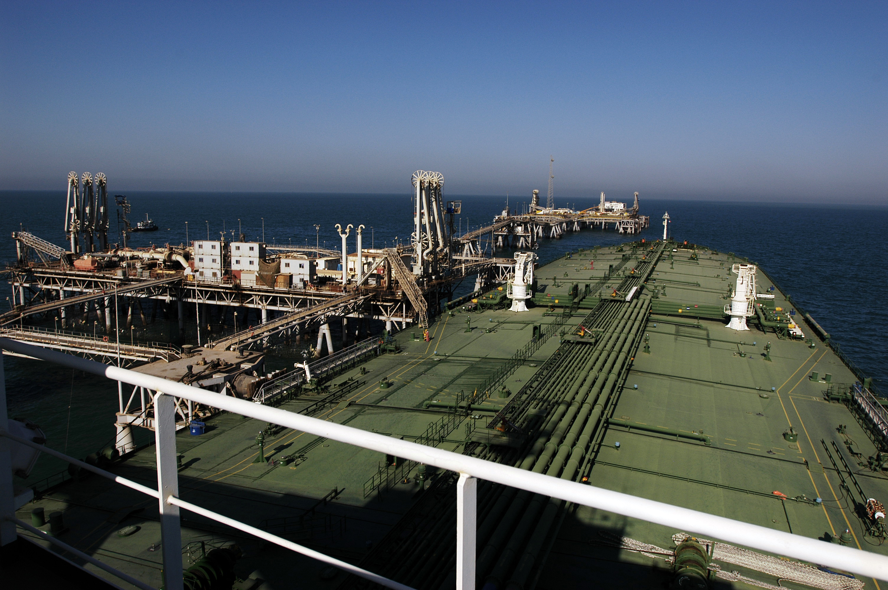 An oil tanker docked to the Al Basrah Oil Terminal takes on crude oil in the Persian Gulf