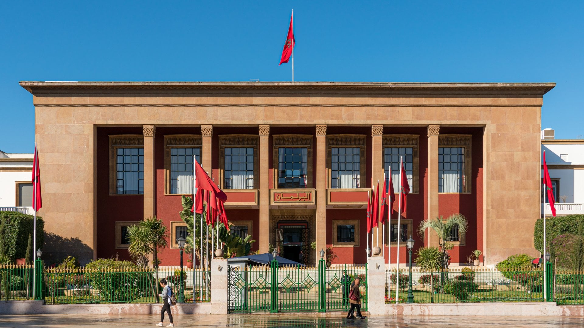 The Moroccan parliament building in Rabat, flying national flags