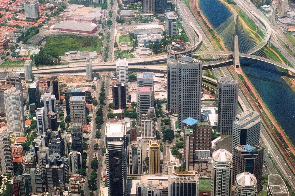 Aerial view of São Paulo's financial district with the Pinheiros river and cable-stayed bridge