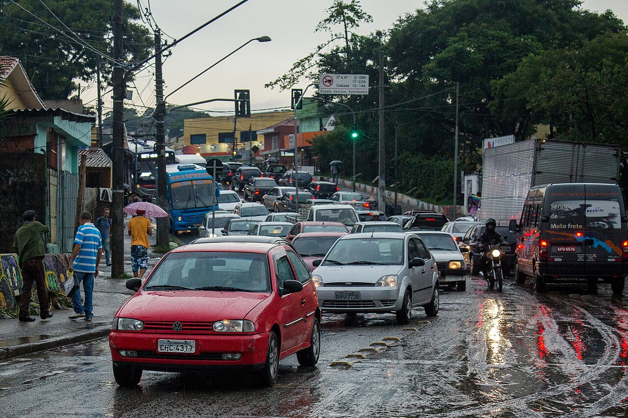 Cars navigating a flooded street in Taboão da Serra, Greater São Paulo, after heavy rain