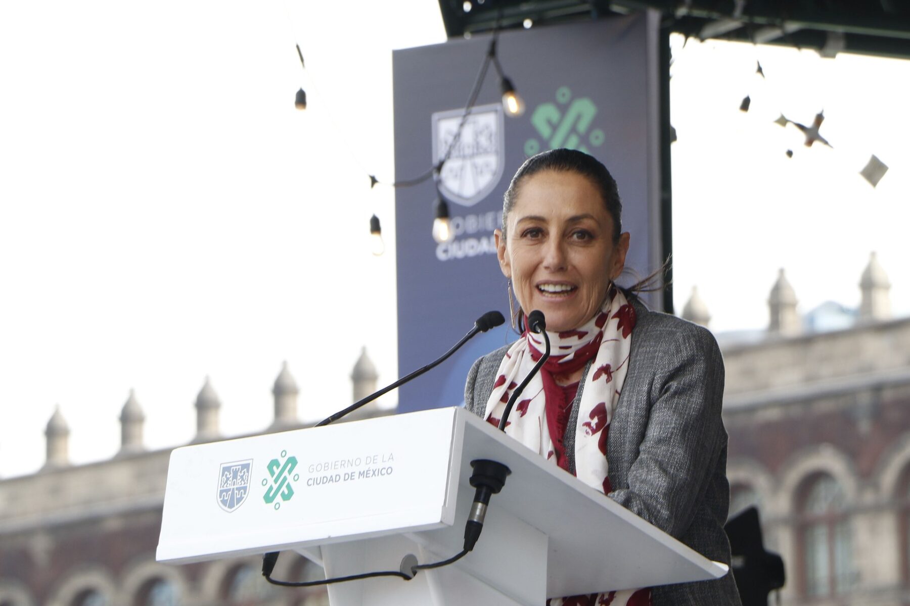 Claudia Sheinbaum speaks at a podium in Mexico City