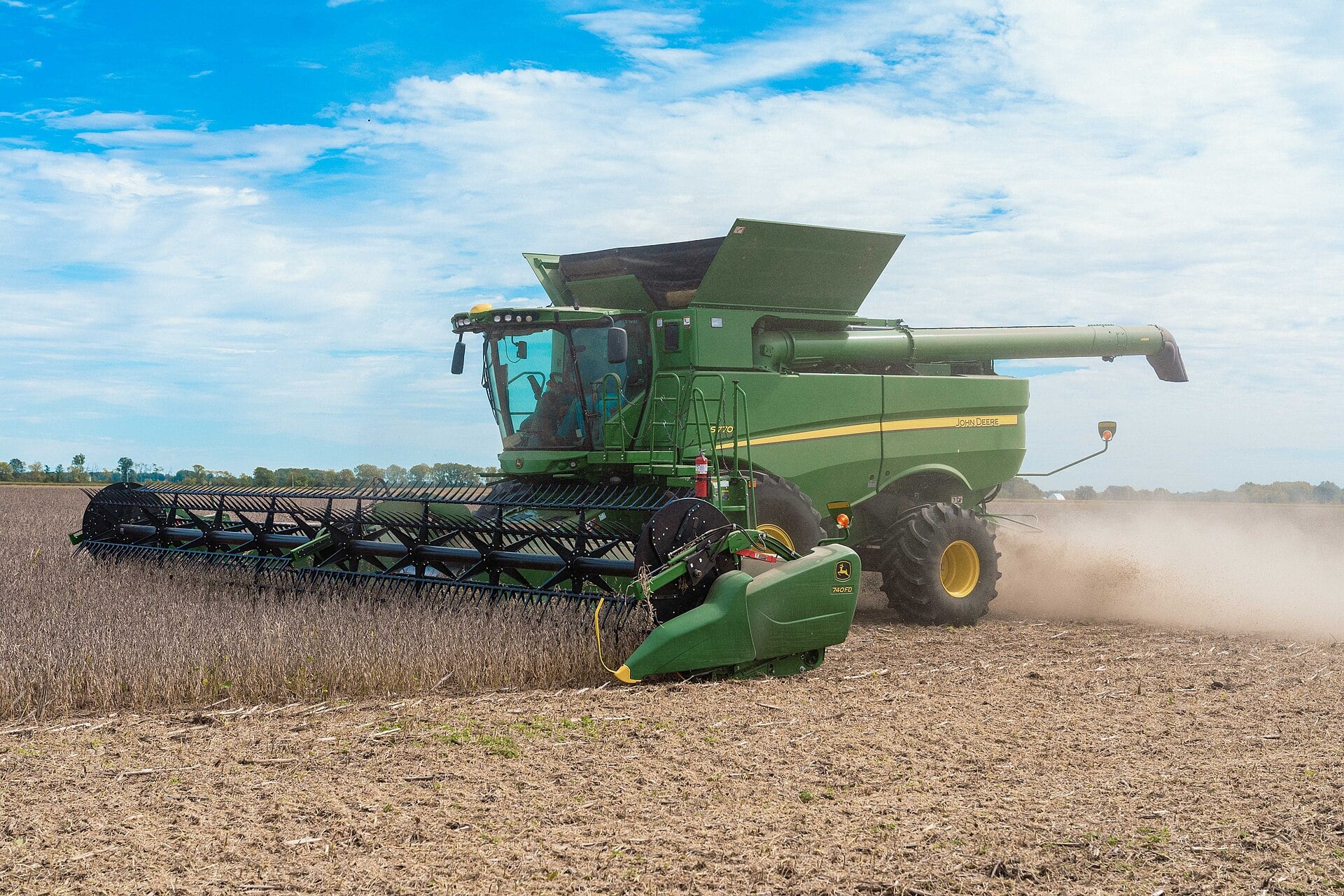 A combine harvesting soybeans; Chicago futures set the price for Brazilian and Argentine growers