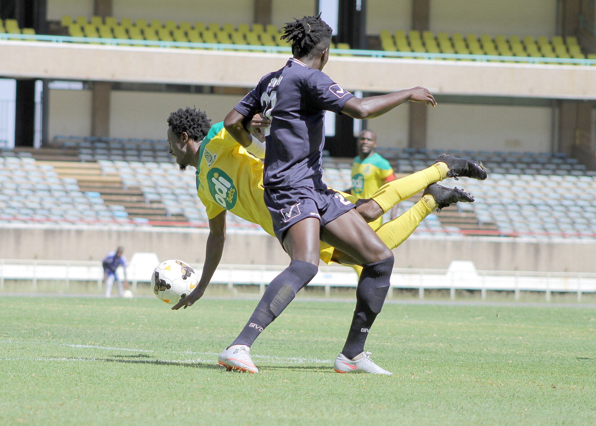 A football match in progress at a Kenyan stadium