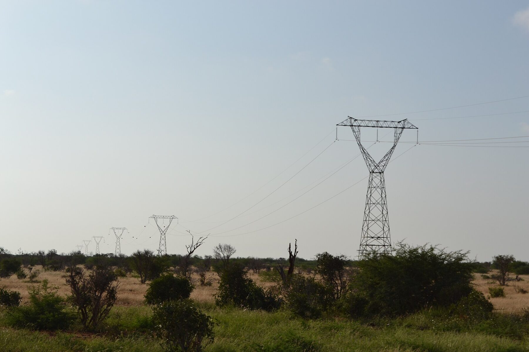 High-voltage electricity transmission lines crossing Tsavo East National Park in Kenya