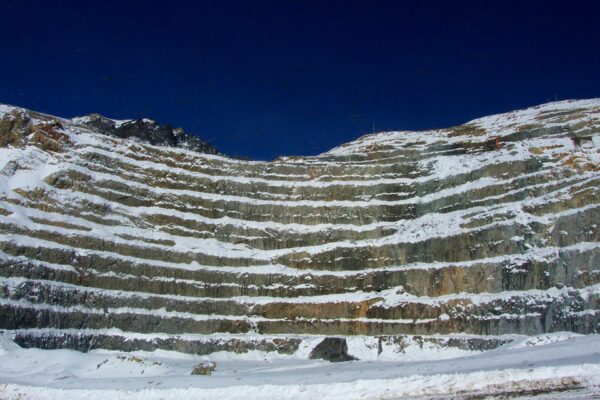 Terraced benches of Codelco’s Andina copper mine in Chile under snow