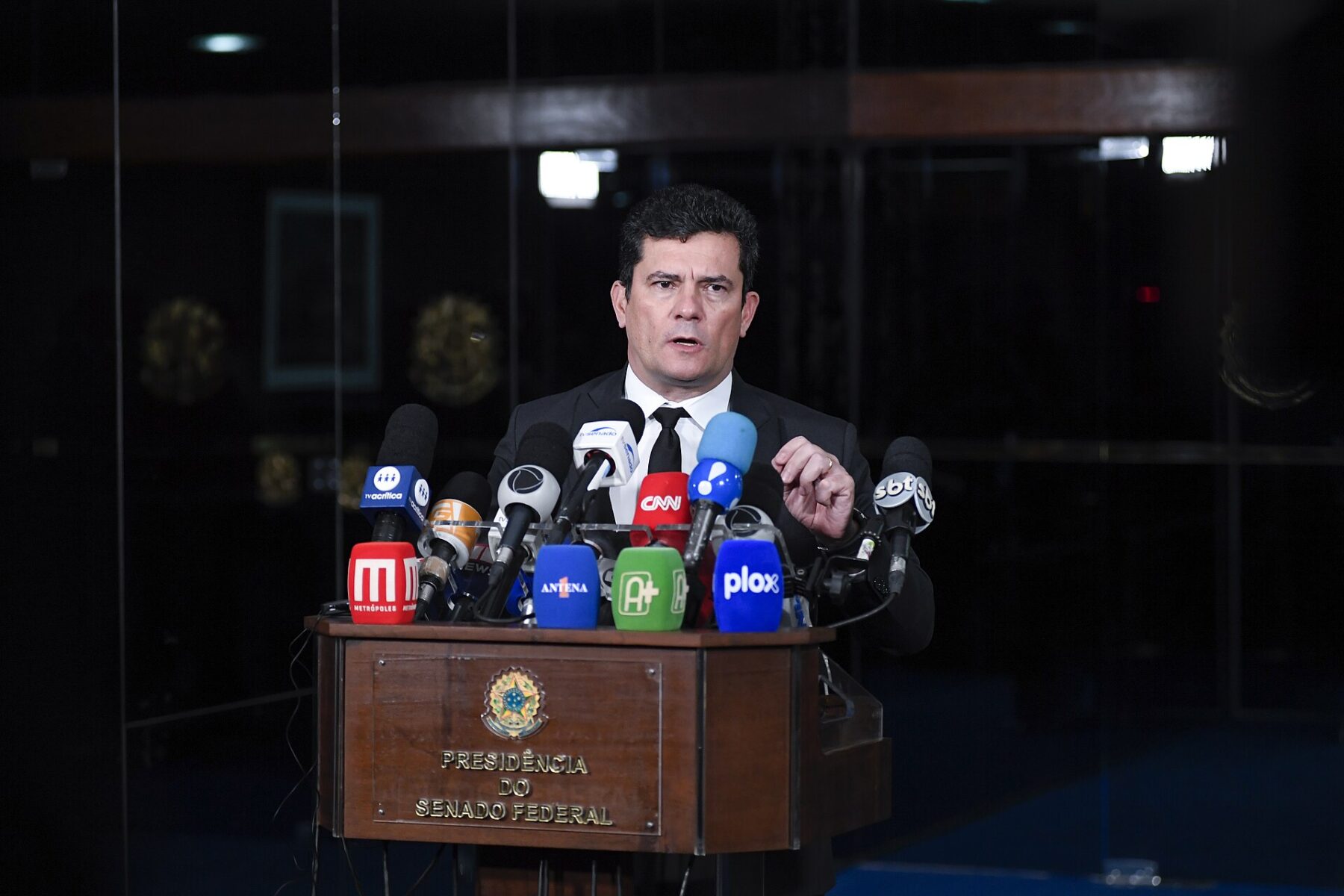 Senator Sergio Moro speaks at a bank of television microphones during a press conference at the Brazilian Senate