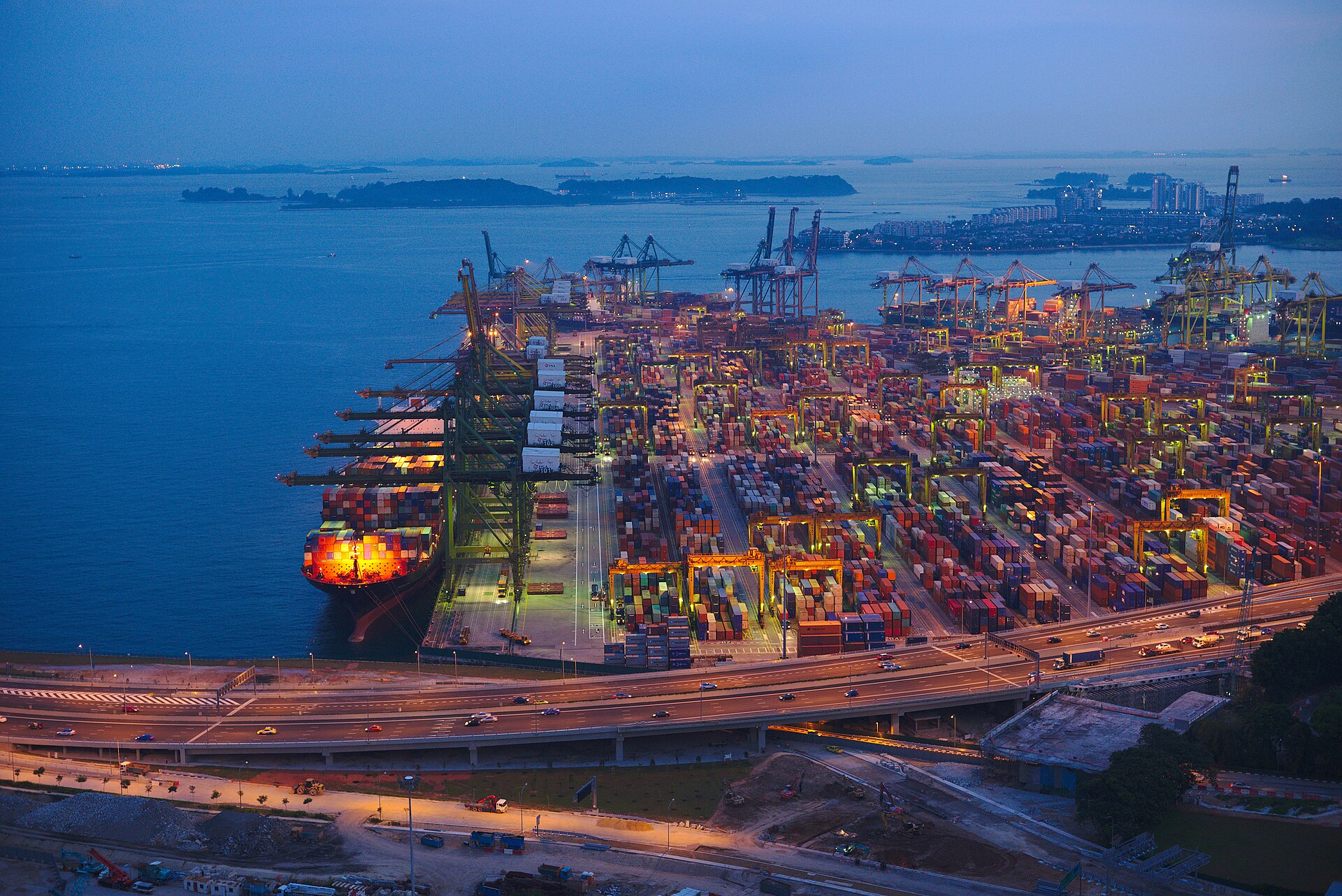 Aerial view at dusk of the Tanjong Pagar container terminal in Singapore with a container ship docked