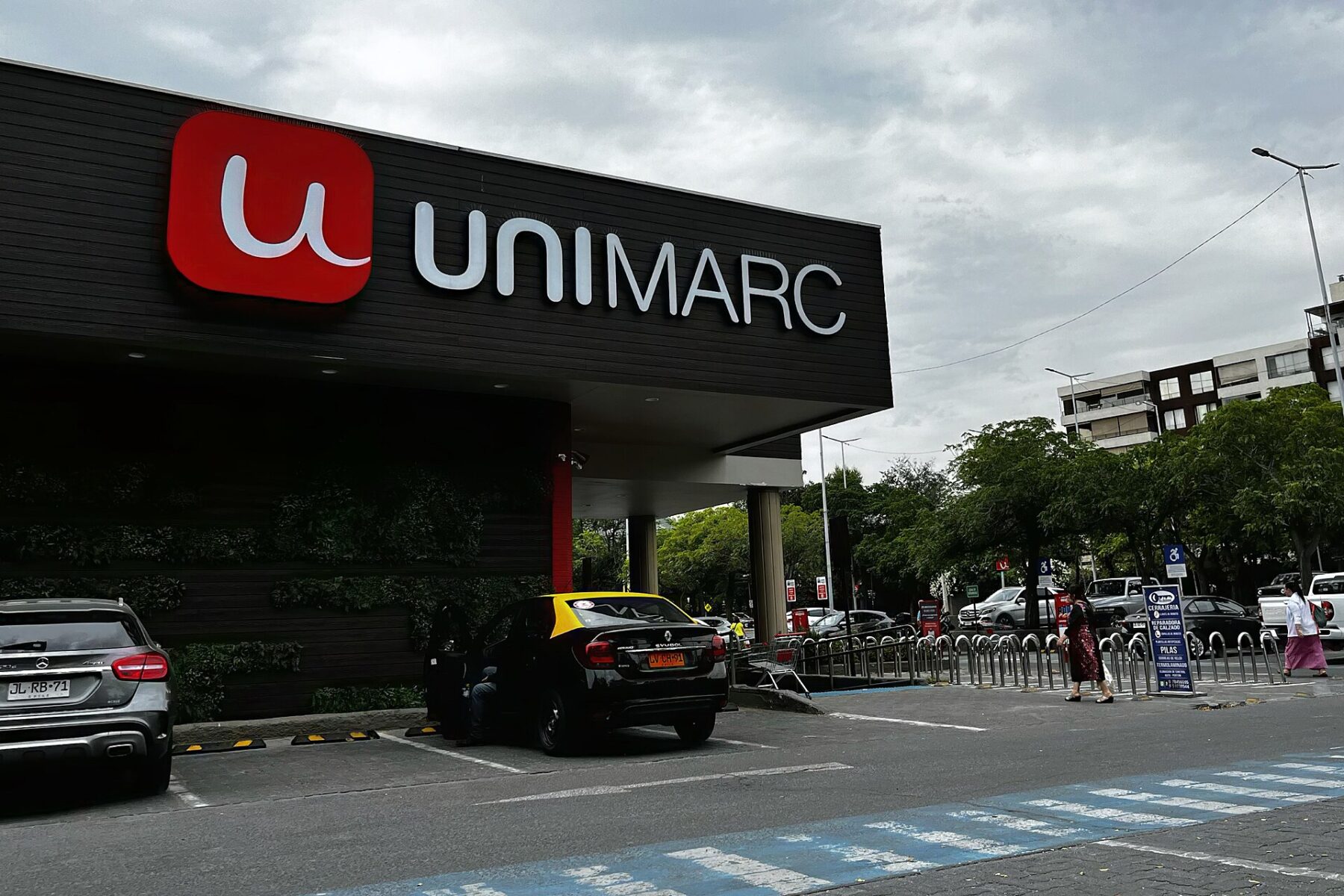 The exterior of a Unimarc supermarket in Santiago, Chile, with the chain's sign above the entrance