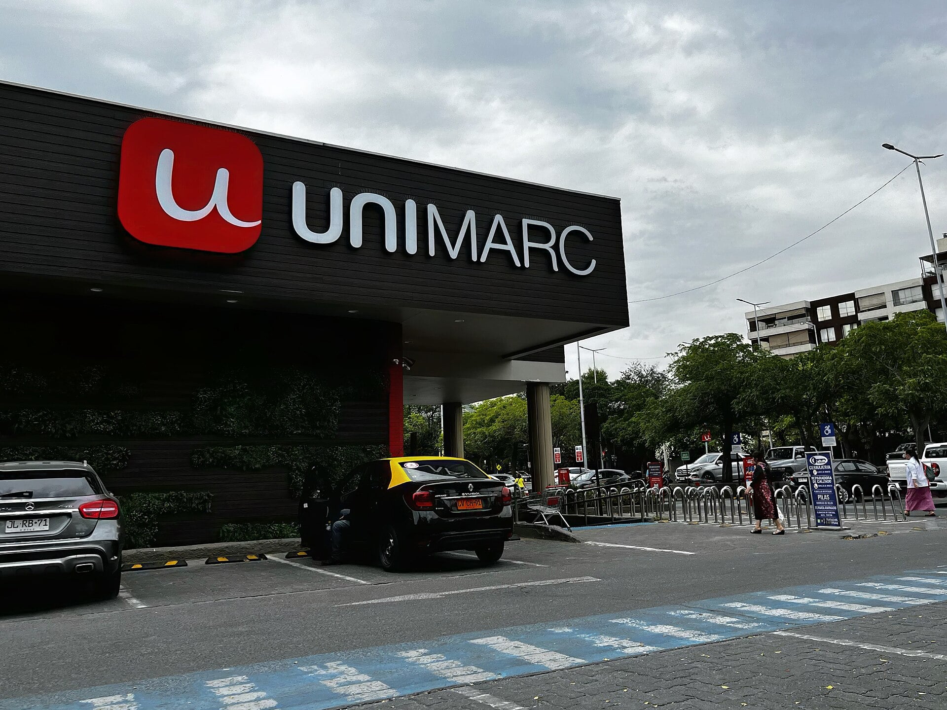 The exterior of a Unimarc supermarket in Santiago, Chile, with the chain's sign above the entrance