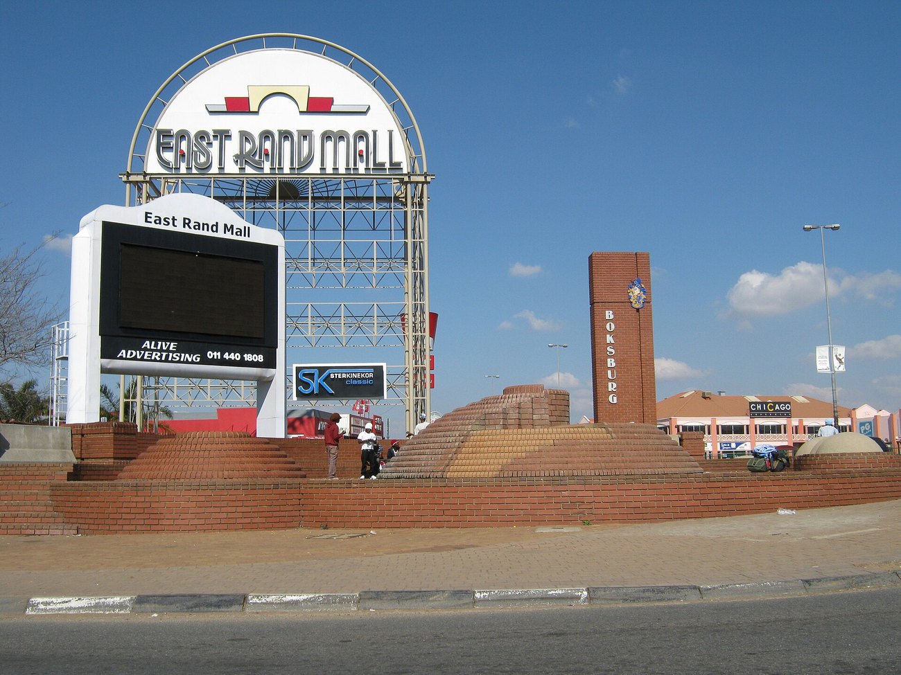 The entrance to the East Rand Mall in Boksburg, with a brick tower carrying the town name under a clear winter sky.