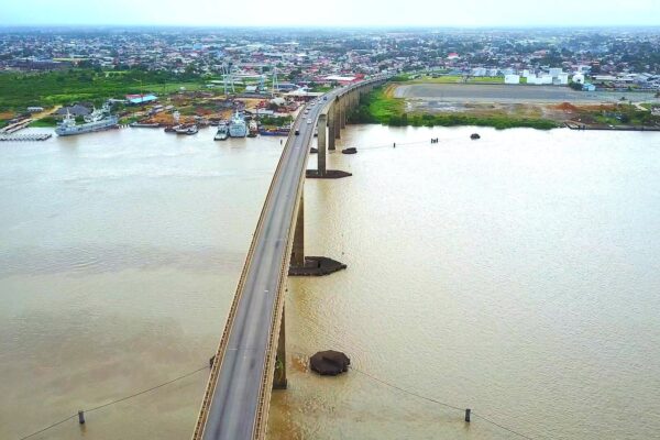 Suriname explained 2026: aerial view of Paramaribo and the Jules Wijdenbosch Bridge over the Suriname River