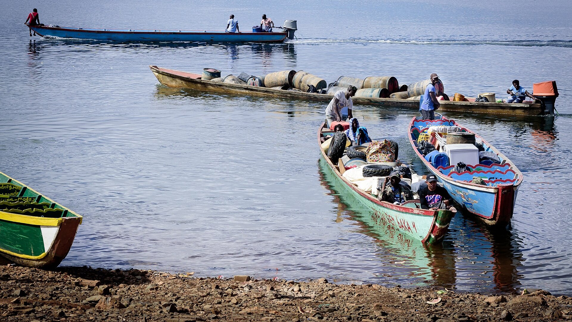 Boats loaded with mining supplies on Brokopondo lake, heading for Suriname’s gold fields in the interior
